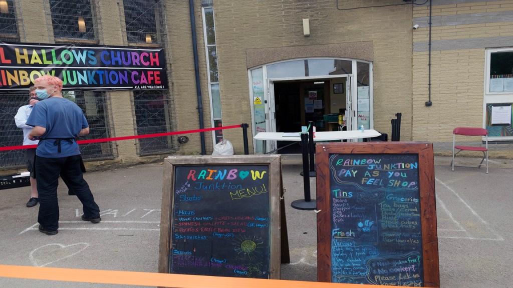 The entrance to Rainbow Junktion, alongside the hot food and shop menu.