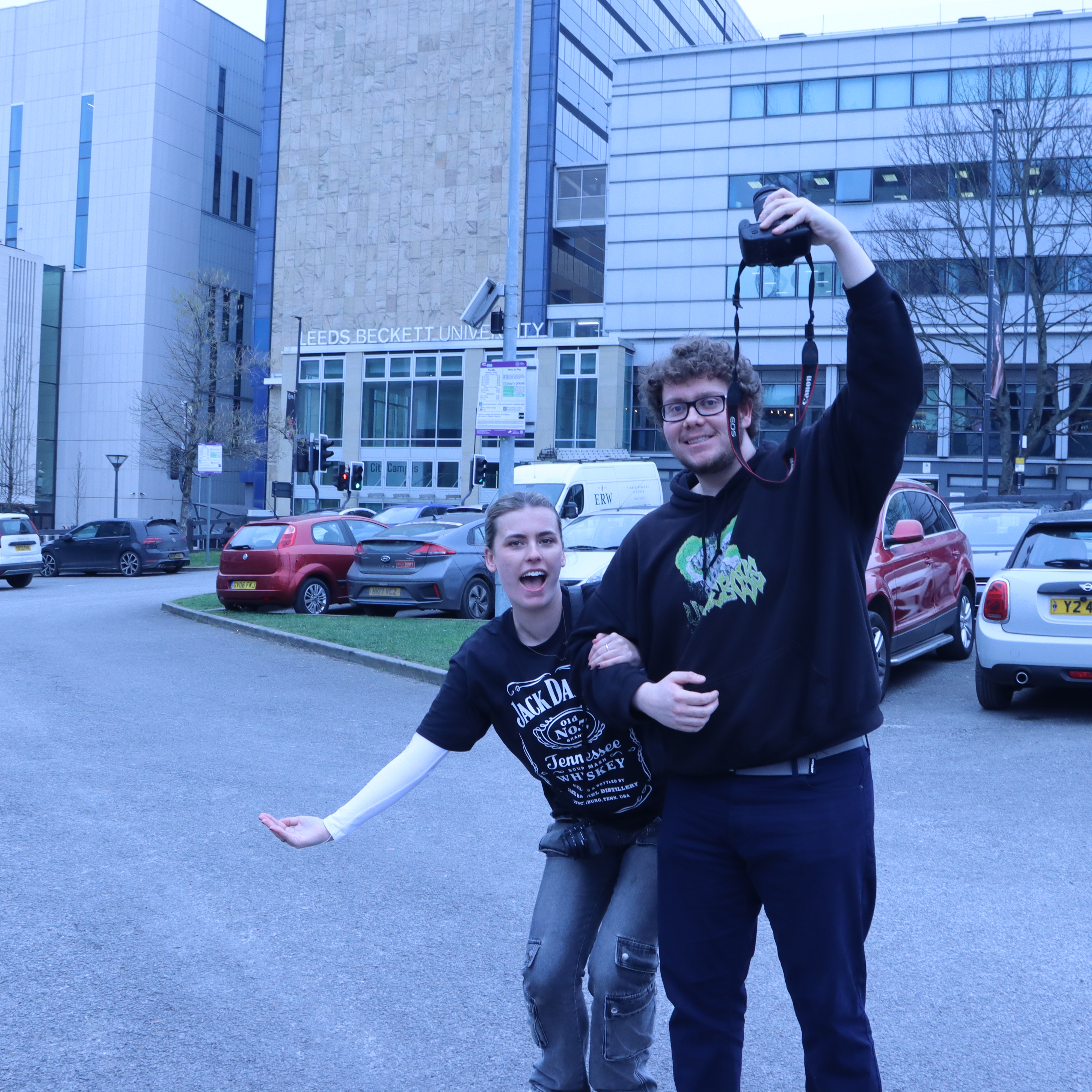 An image of a man and a women making the letter C together.