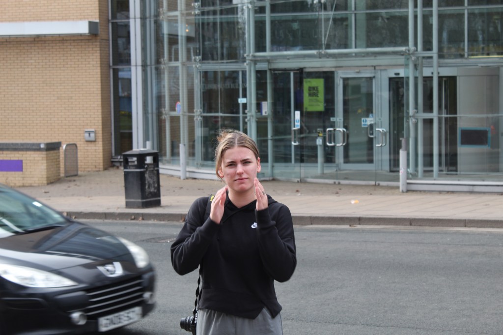 Rosie stood on side of the road as a car drives past