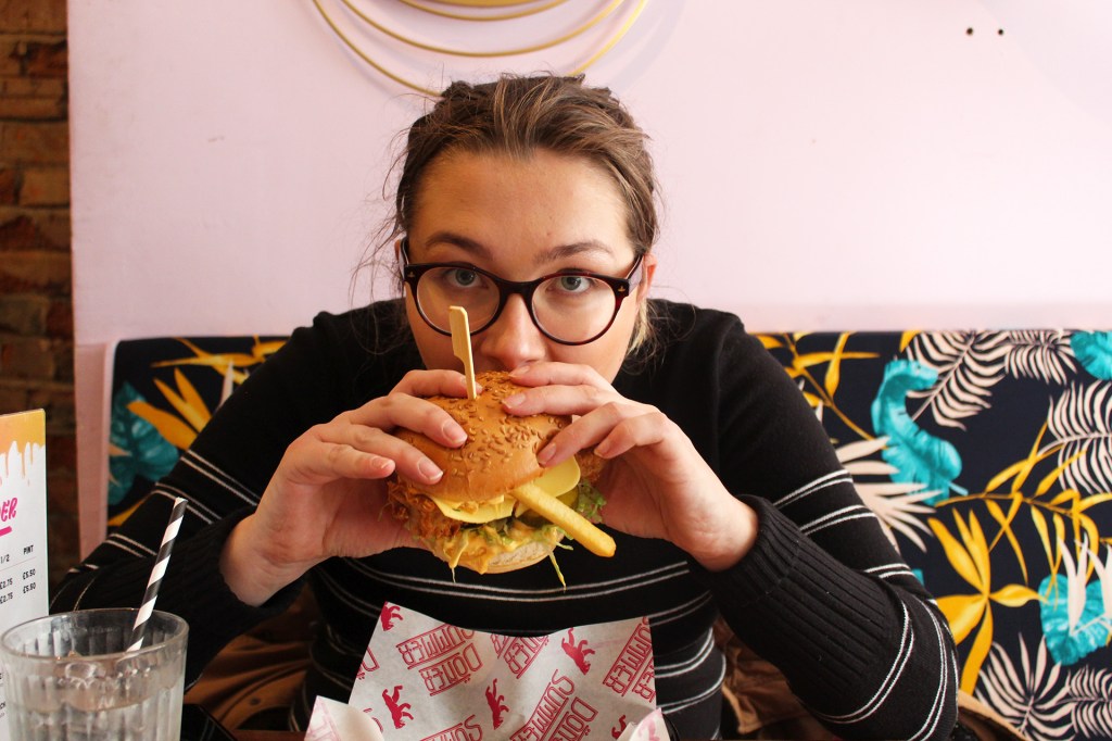 Person eating vegan burger