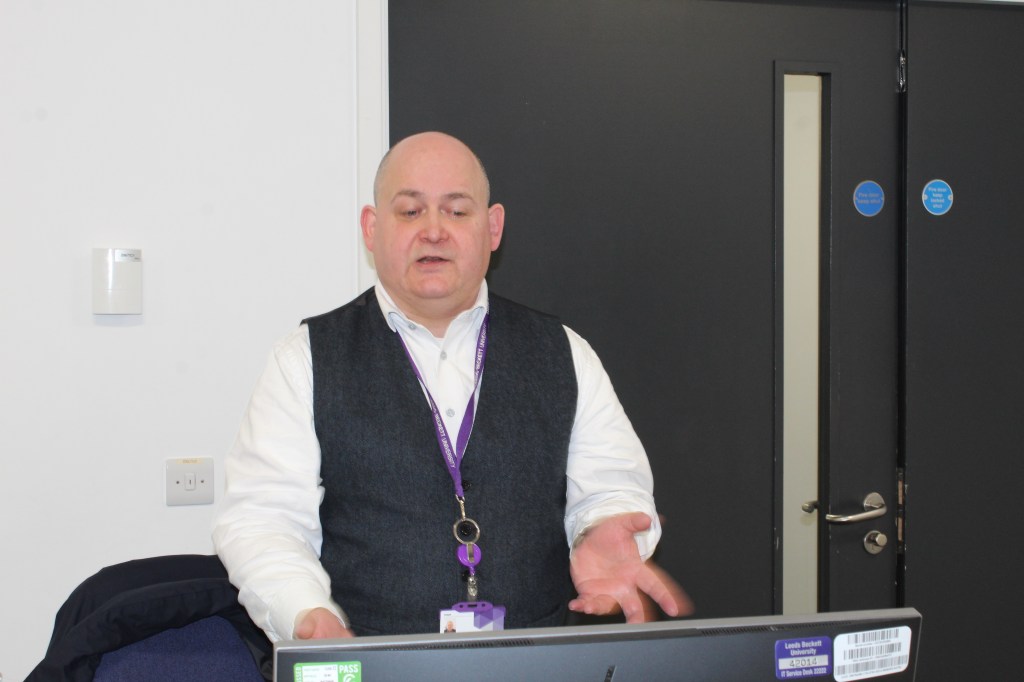 Karl stood in the classroom teaching