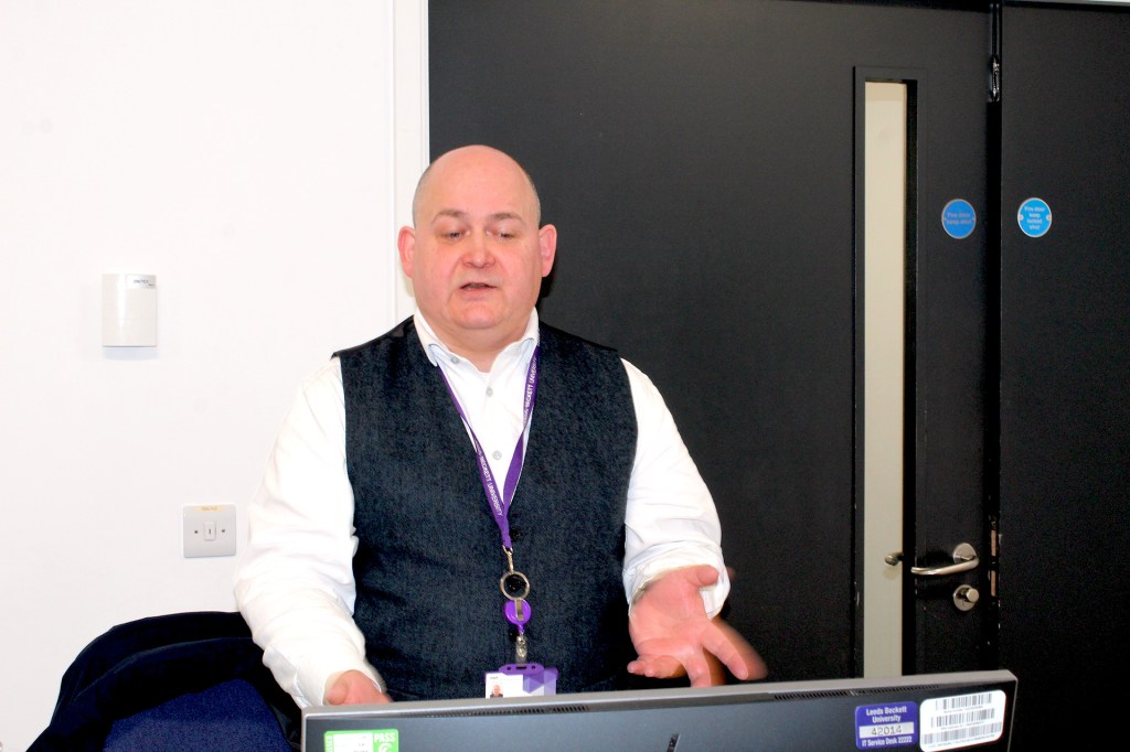 Karl stood in the classroom teaching