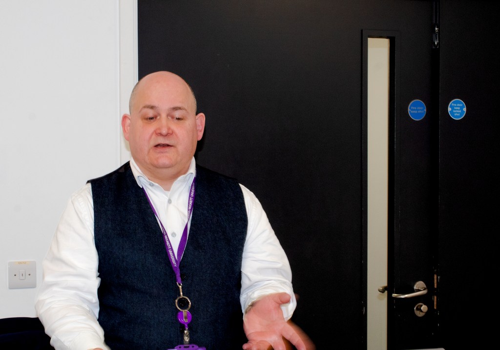 Karl stood in the classroom teaching