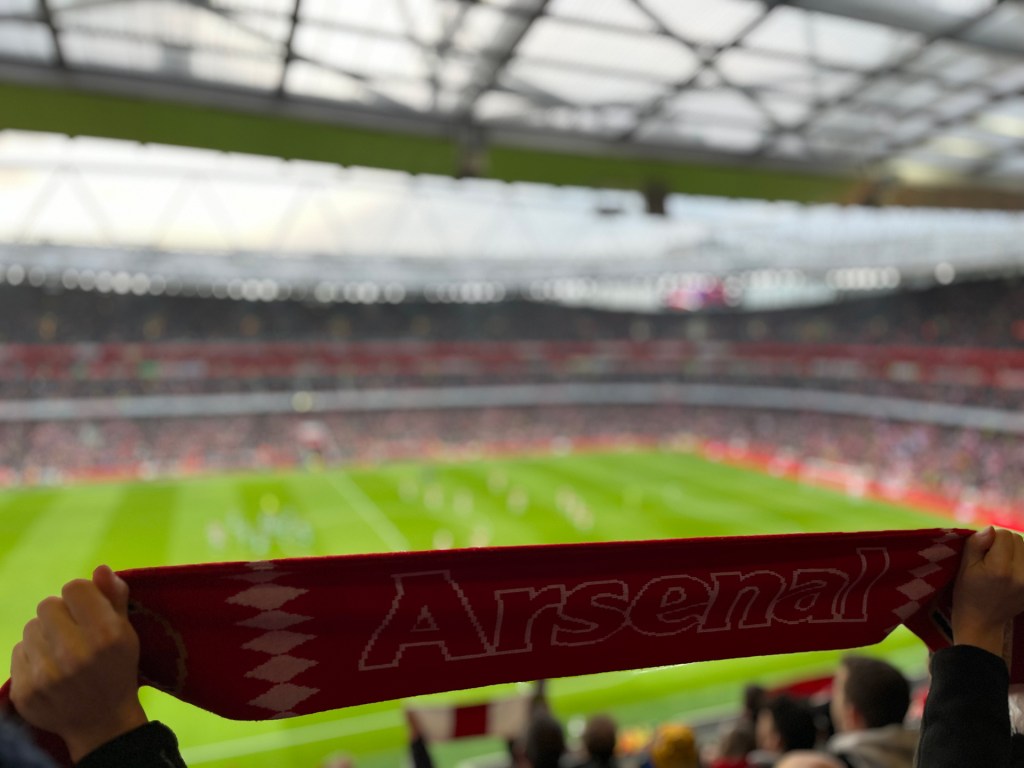 A scarf is held up during the pre game rendition of 'North London Forever'. 