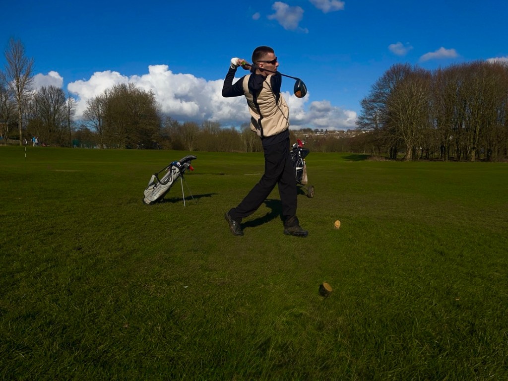 Golfer in his follow through