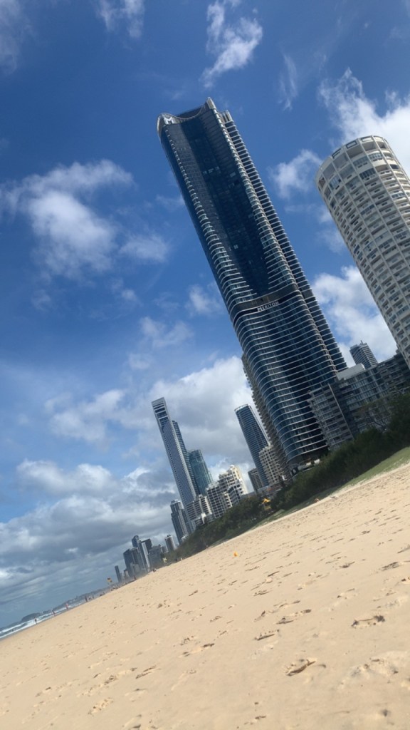 Tilted image of Surfers Paradise with the beach, skyline and ocean in view. 