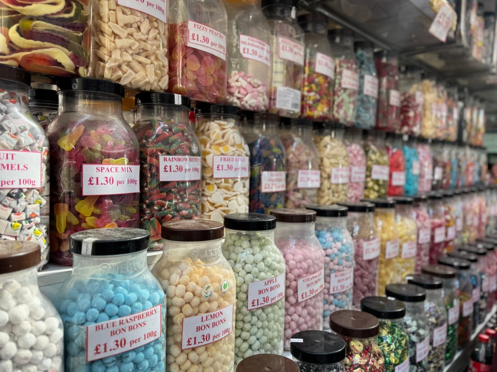 Rows of jars filled with sweet treats in Kirkgate Market, with the foreground in sharp focus and the background gradually blurred