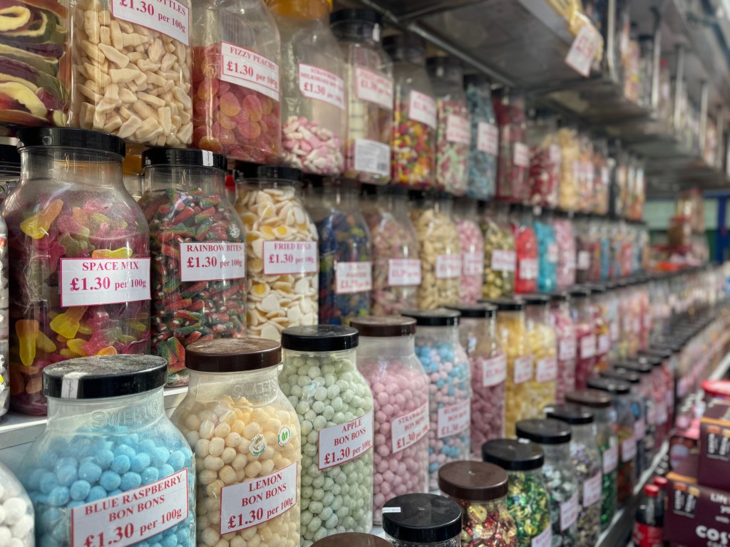 Rows of jars filled with sweet treats in Kirkgate Market, with the foreground in sharp focus and the background gradually blurred