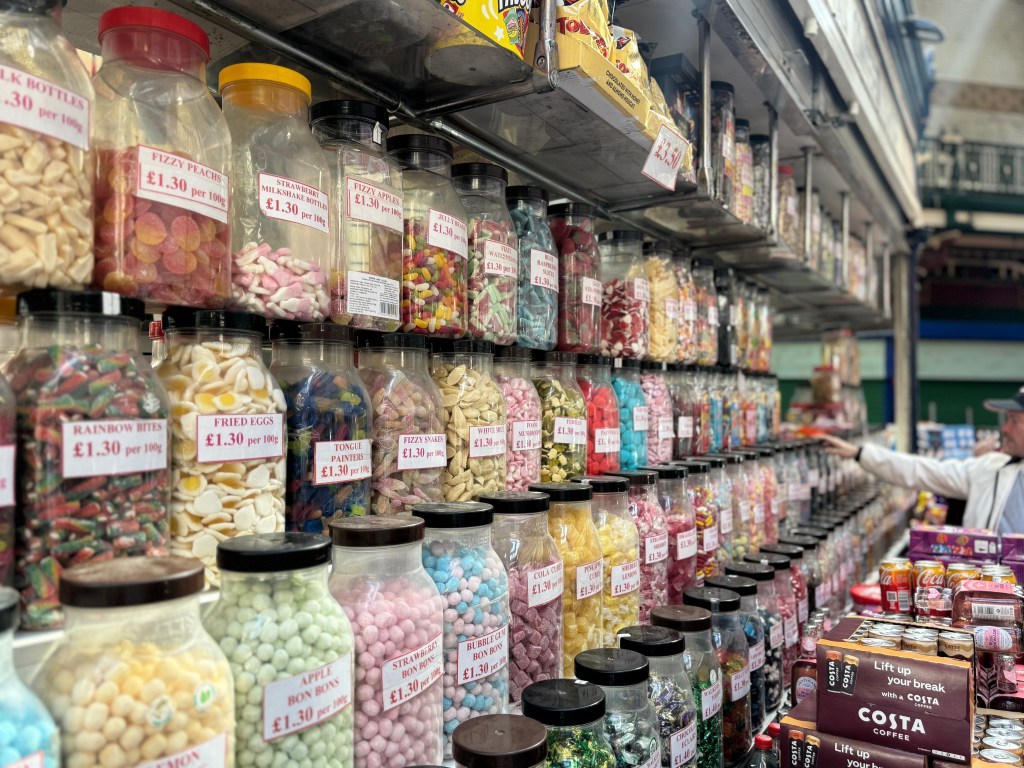 Rows of jars filled with sweet treats in Kirkgate Market, with the foreground in sharp focus and the background gradually blurred