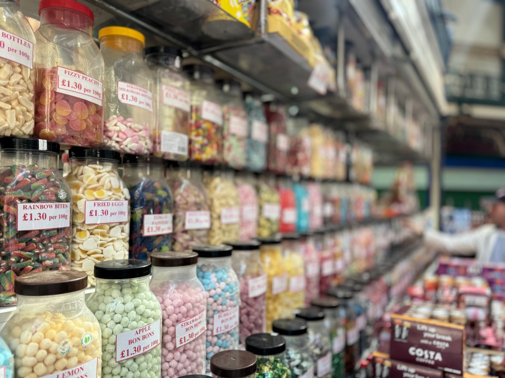 Rows of jars filled with sweet treats in Kirkgate Market, with the foreground in sharp focus and the background gradually blurred