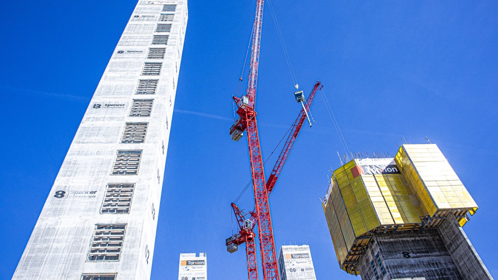 Current building work going on near student accommodation flats with high cranes in the sky.  