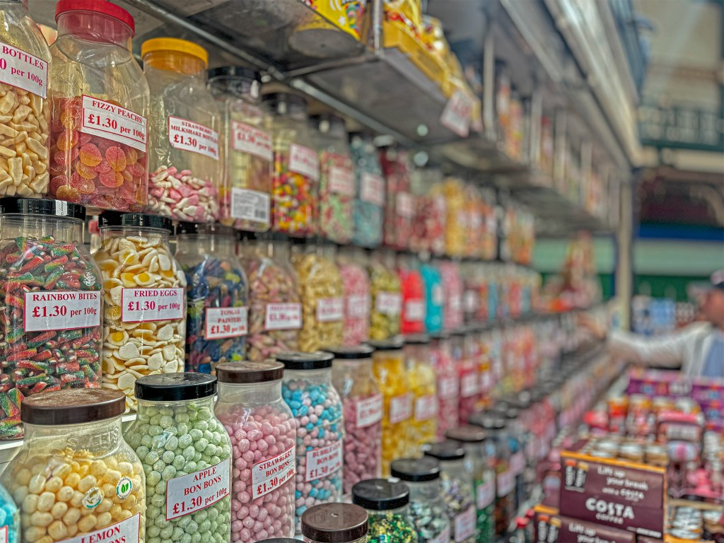 Rows of jars filled with sweet treats in Kirkgate Market, with the foreground in sharp focus and the background gradually blurred
